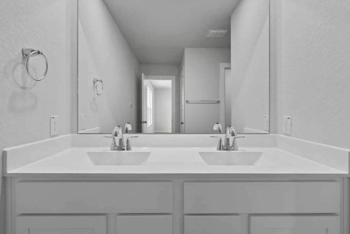 A bathroom with two sinks.