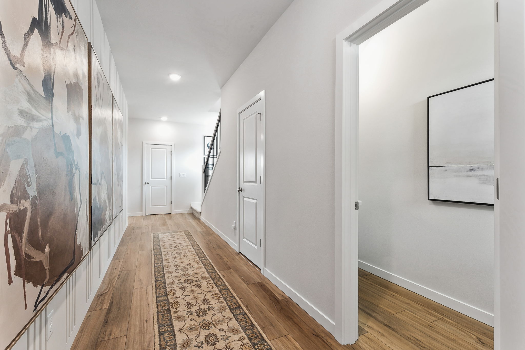 A hallway with white walls.