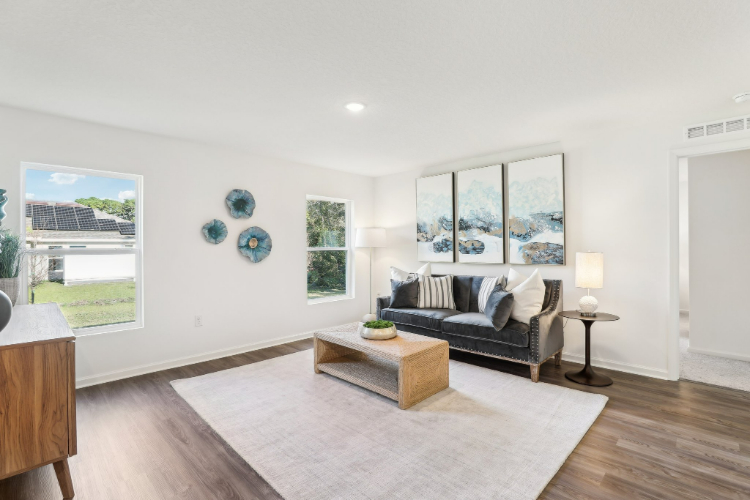 A living room with a couch and a coffee table.