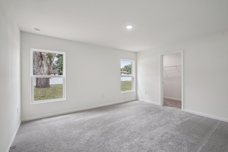 A room with a window and a door.