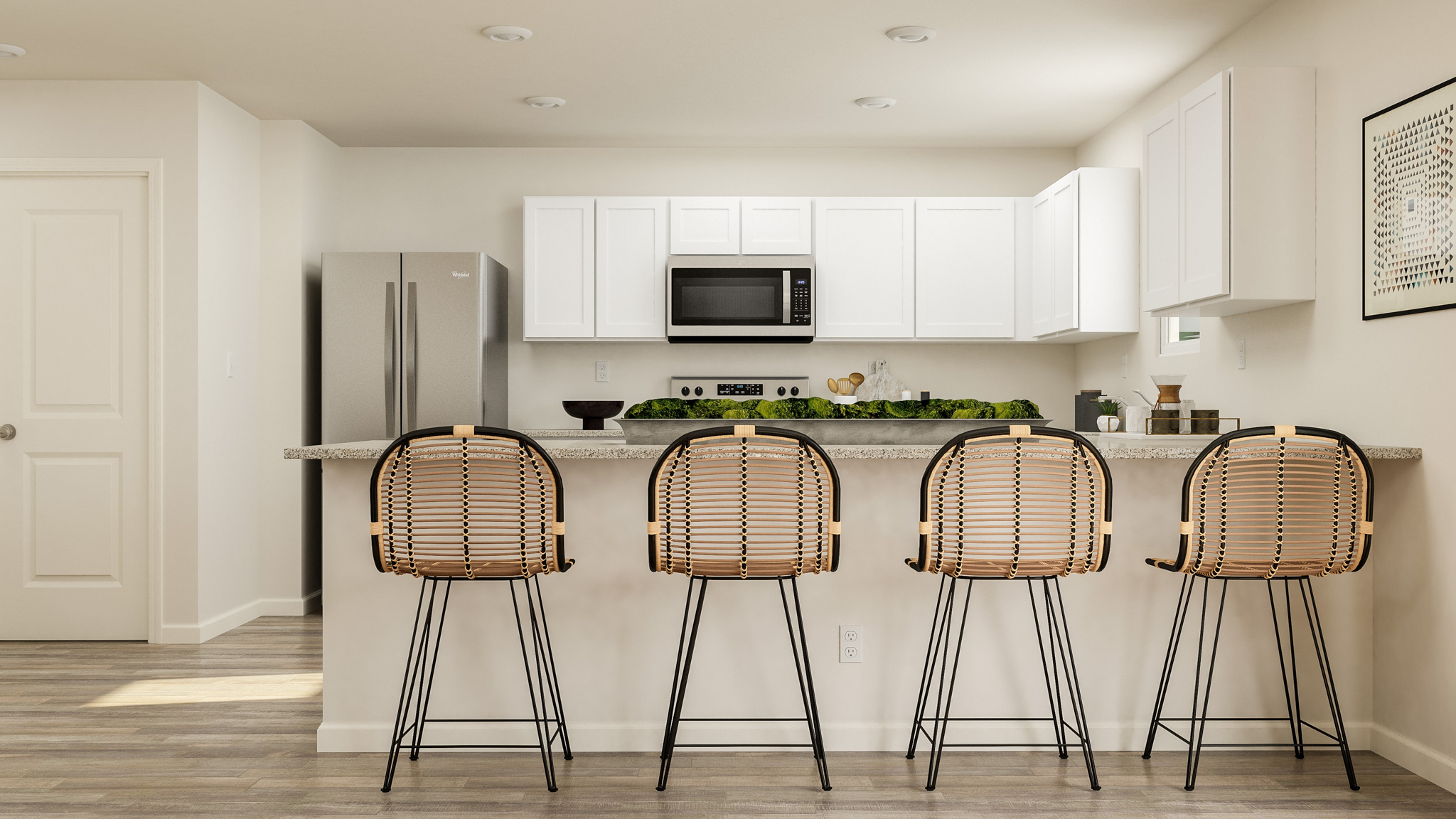 A kitchen with stools and a table.