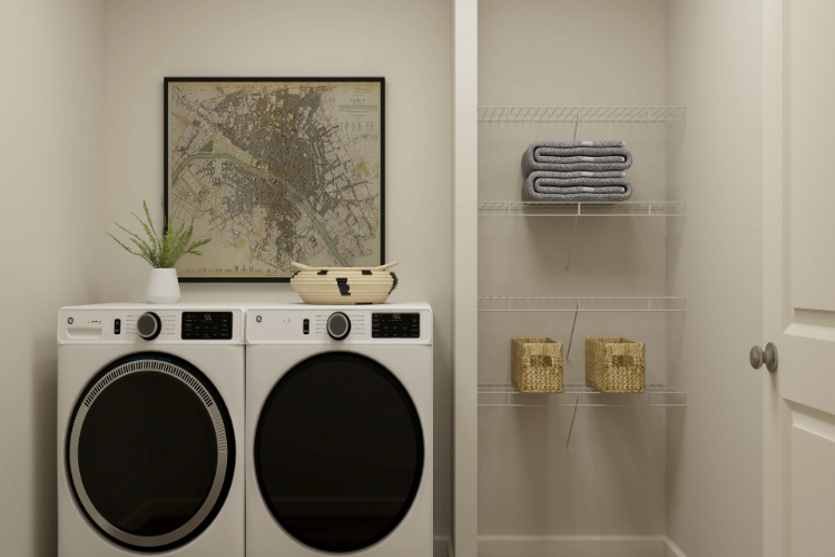 A white laundry room with a washer and dryer.