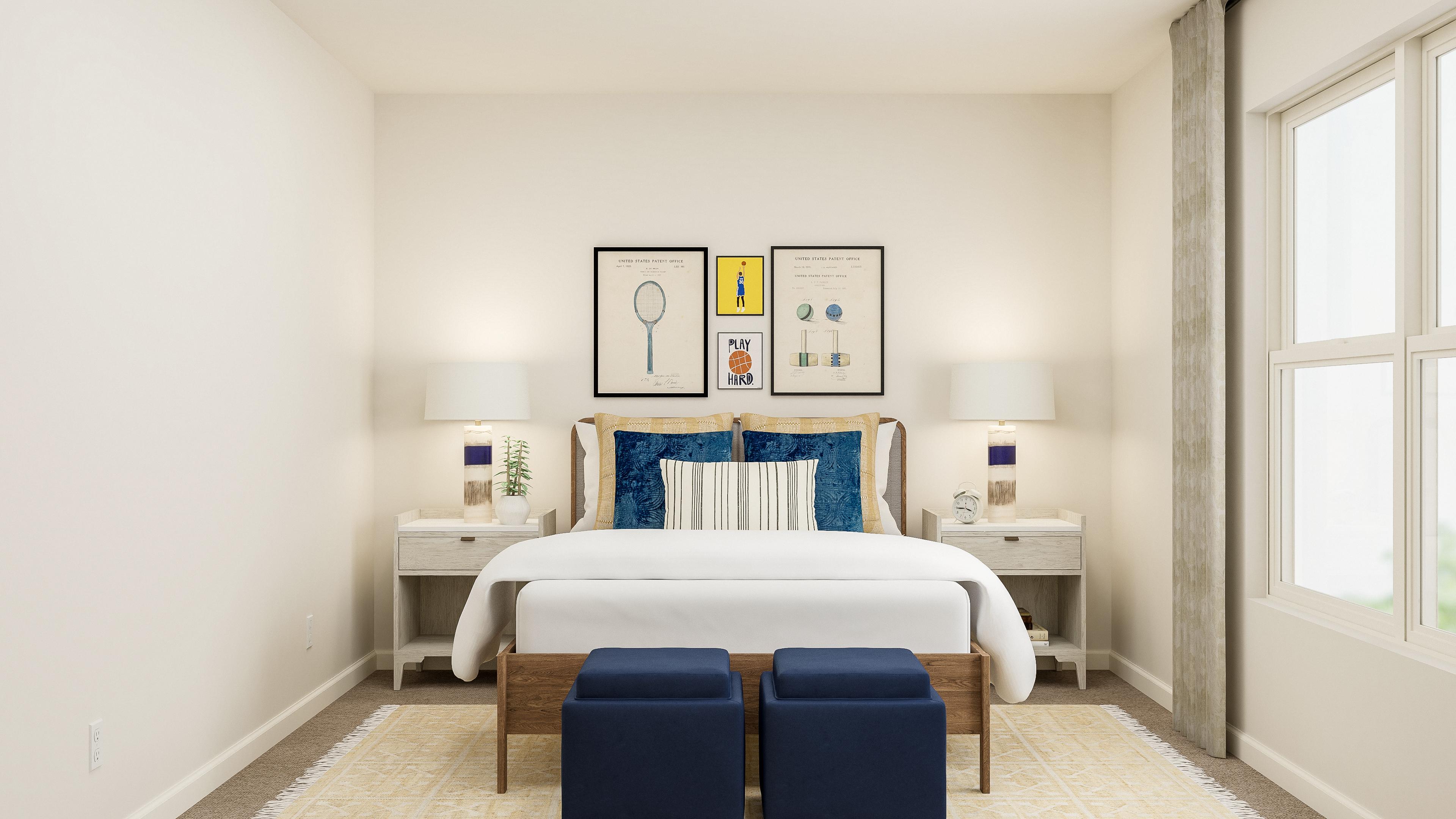 A room with a bed and chairs.