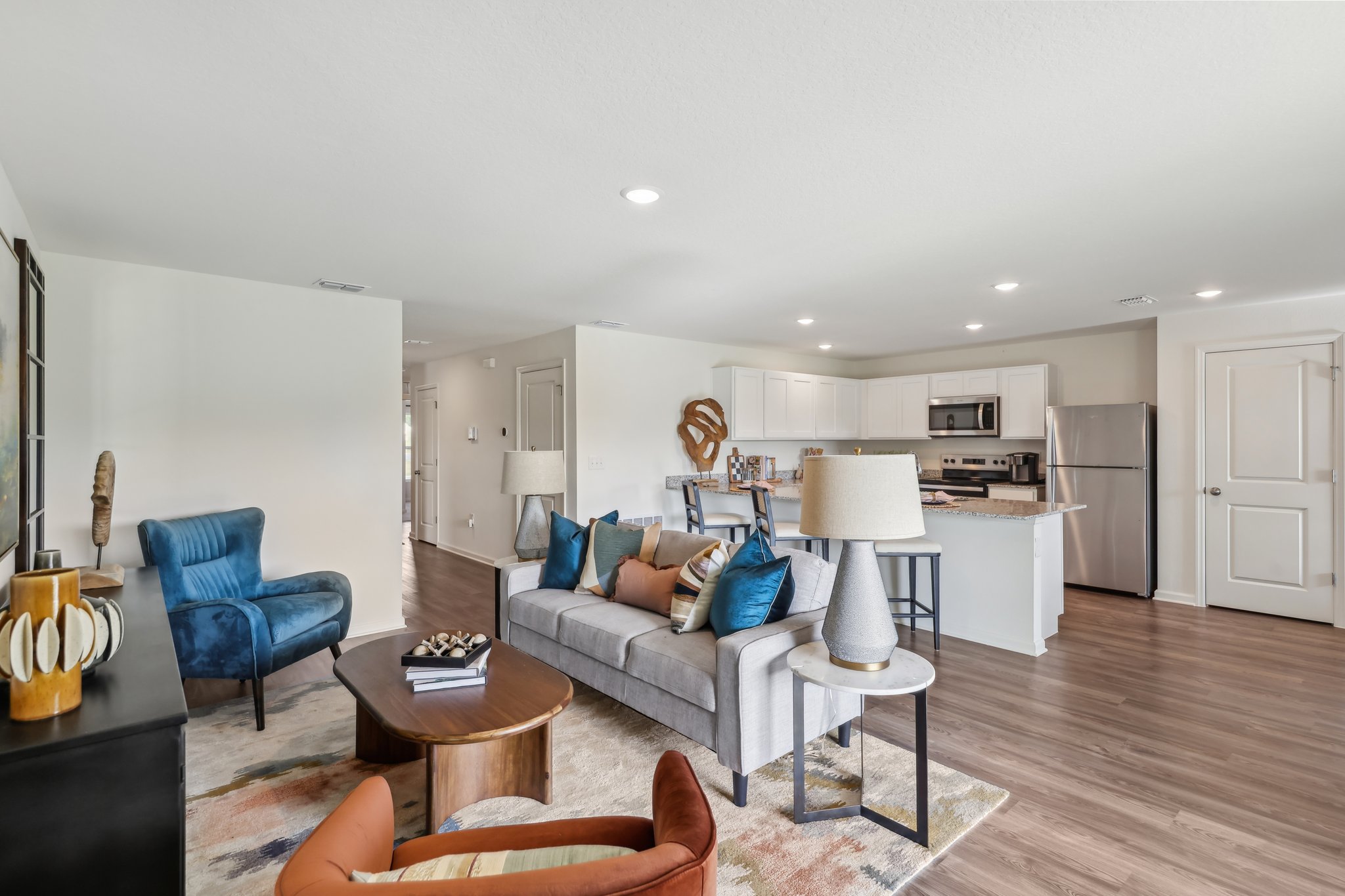A living room with a wood floor.
