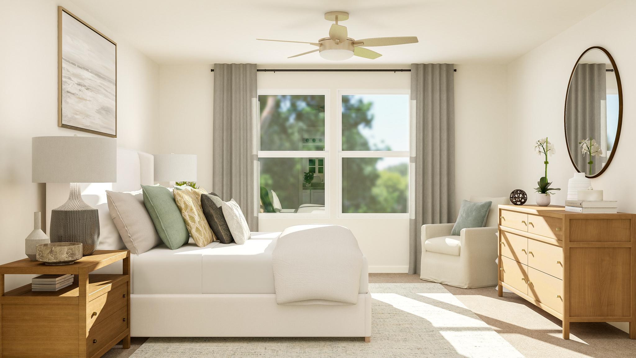 A living room with a white couch and a white table.