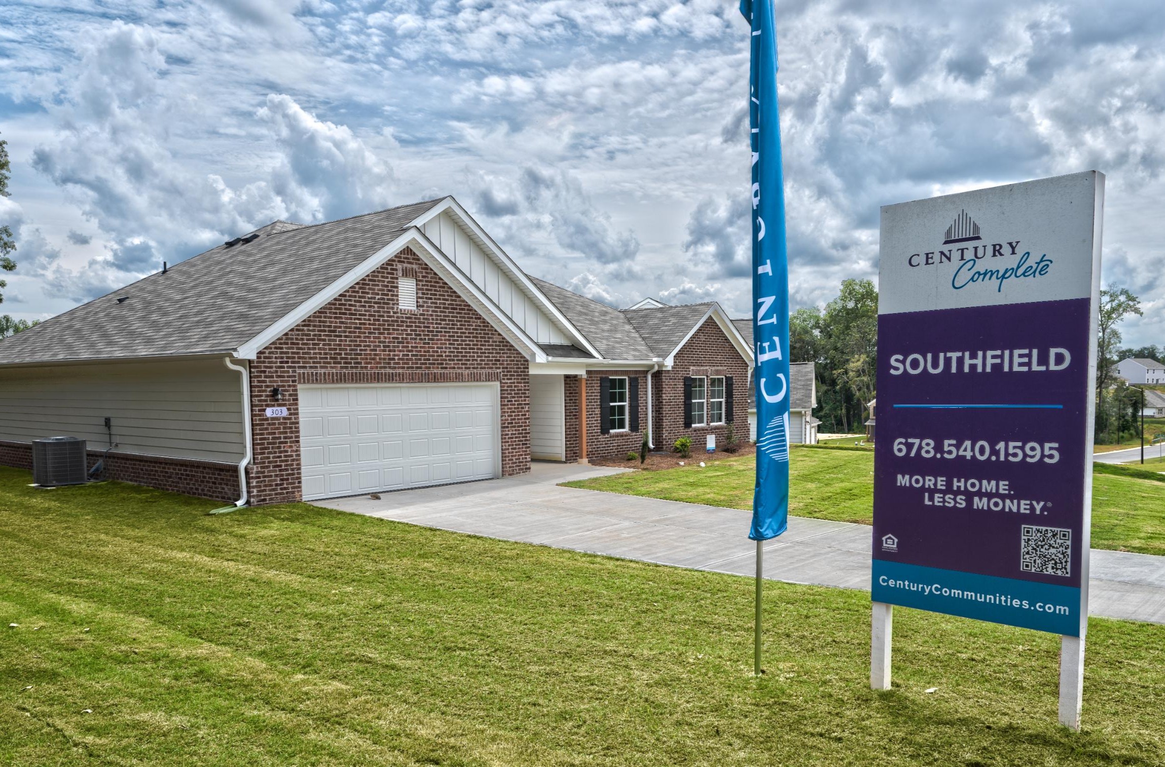 A sign in front of a house.