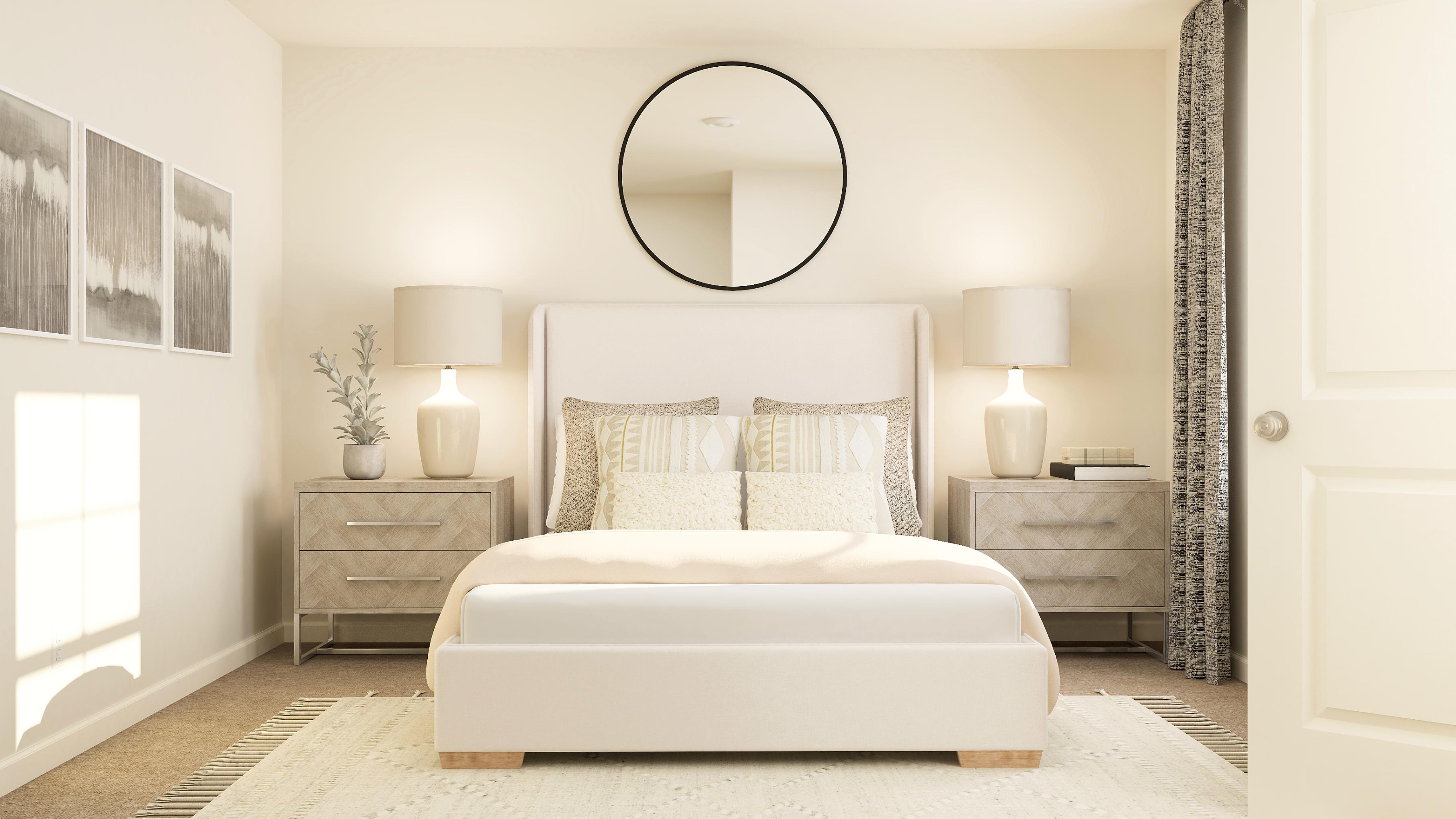 A bedroom with a white bed and lamps.
