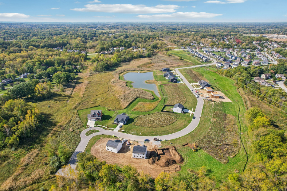A landscape with houses and trees.